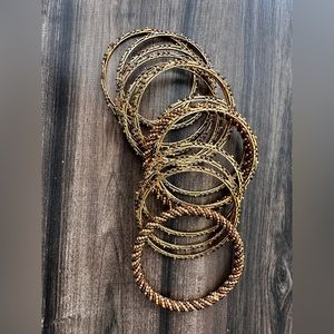 Beautiful gold toned bangle bracelets with brown beading